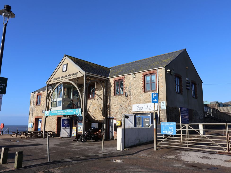 A building with windows and signage at Charmouth Heritage Coast Centre in Charmouth