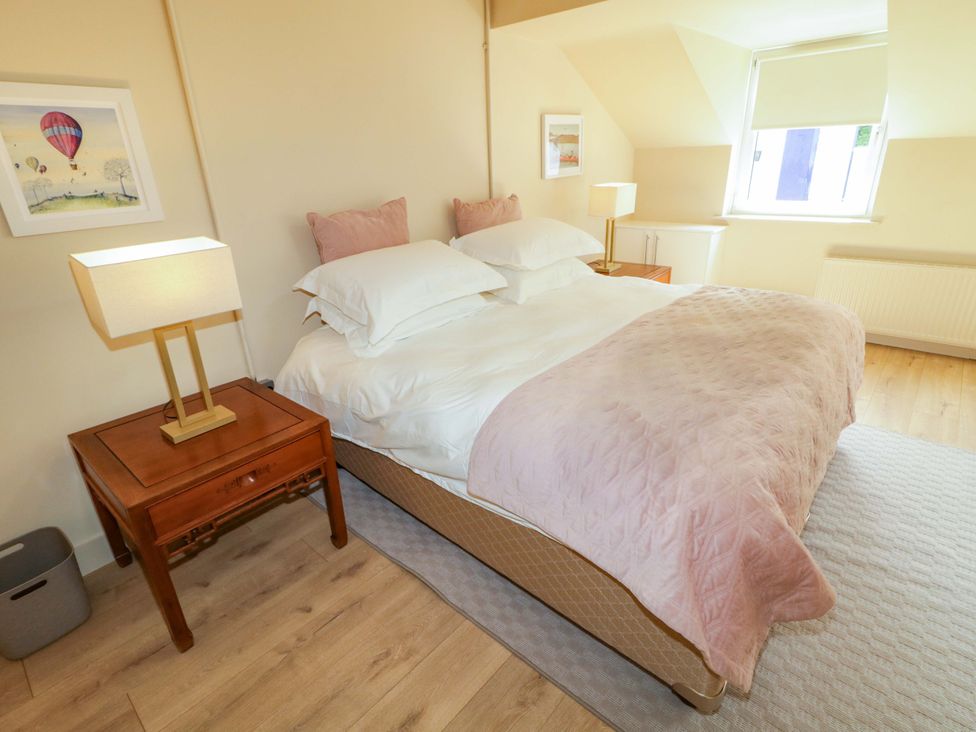 A bedroom with a bed and nightstand at Apartment 2 in Derry