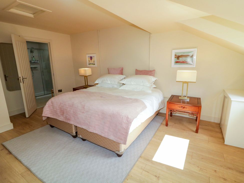 A bedroom with a bed and nightstand at Apartment 2 in Derry