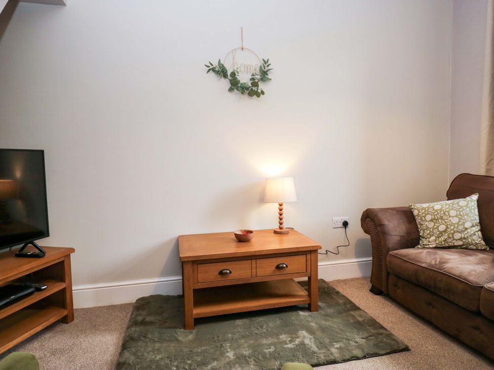 A living room with a coffee table and sofa at Tethera in Ennerdale