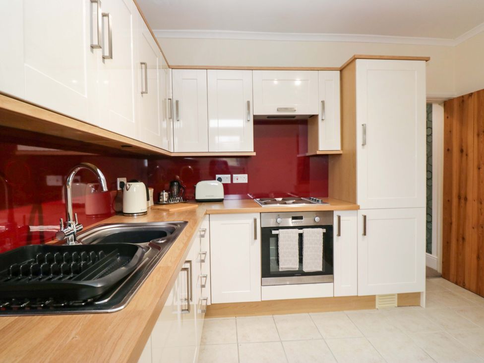 A kitchen with sink and appliances at Tethera in Ennerdale