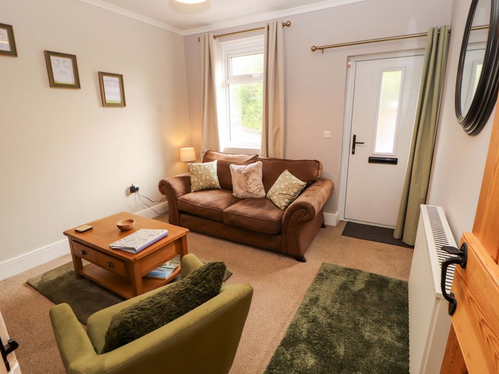 A living room with a sofa and coffee table at Tethera in Ennerdale