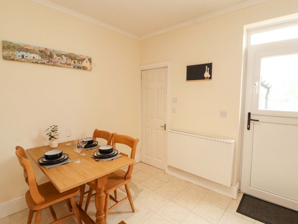 A dining room with a table and chairs at Tethera in Ennerdale
