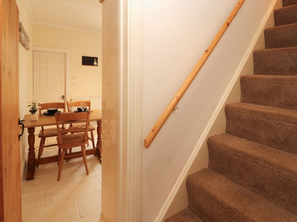 A dining room with a table and chairs at Tethera in Ennerdale