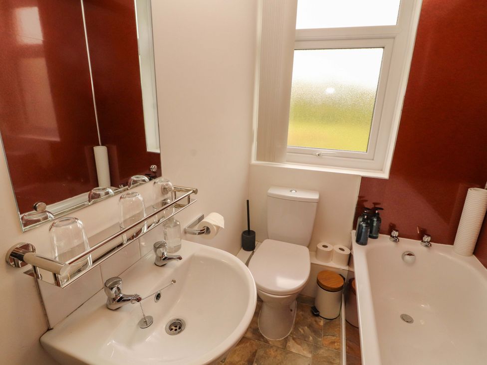 A bathroom with a sink a toilet and a bathtub at Tethera in Ennerdale