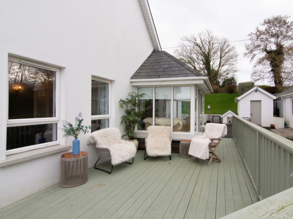 An outdoor area featuring chairs and a plant at An Grianan Getaway in Burt
