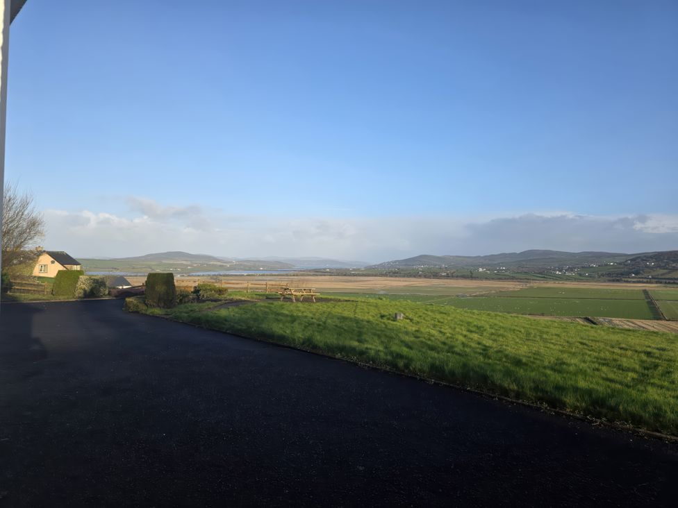 A view of fields and hills from a property at An Grianan Getaway in Burt