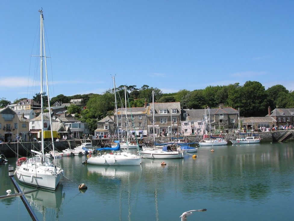 A harbor with boats and buildings at Mays Cottage Wadebridge