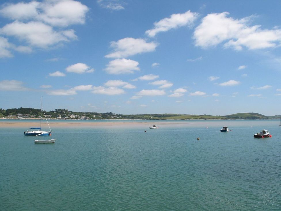 A scenic view of water with boats at Mays Cottage in Wadebridge