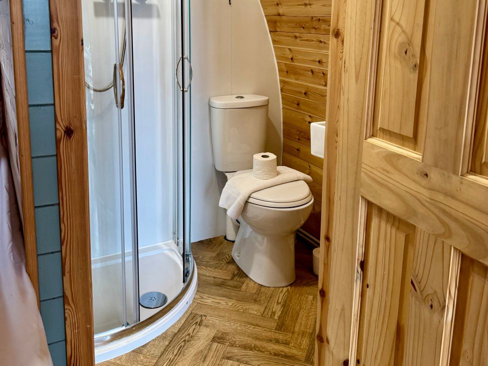 A bathroom with a shower and toilet at Heather Heights in Whitby