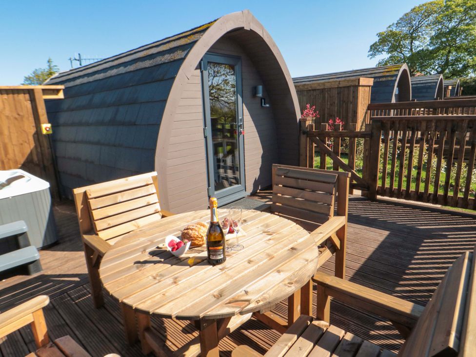 An outdoor area with a table and chairs at Heather Heights in Whitby