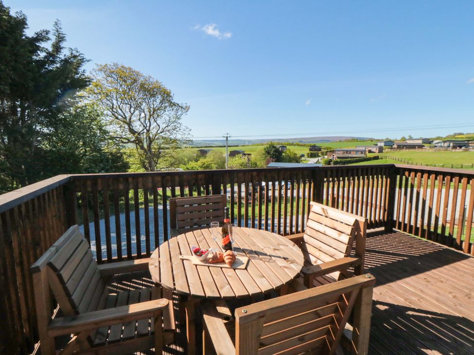 An outdoor seating area with a table and chairs at Rosemary Retreat in Whitby