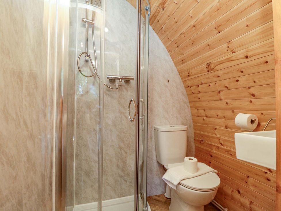 A bathroom with a shower and toilet at Sage Sanctuary in Whitby