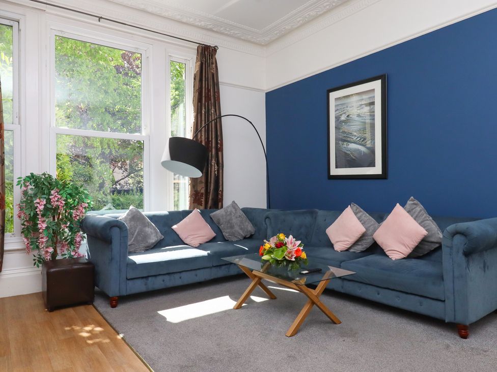 A living room with a sofa and coffee table at Apartment 2 in Torquay