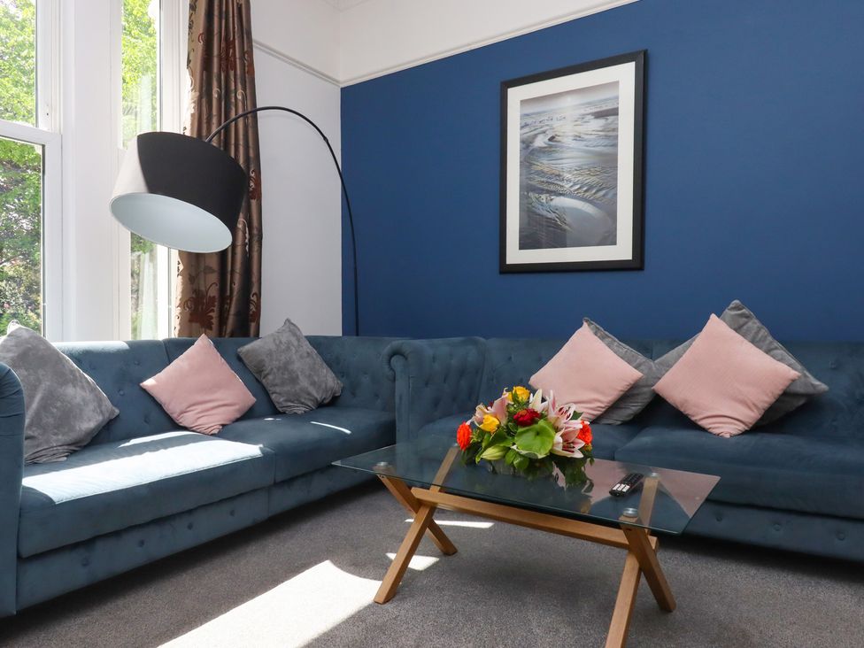 A living room with a sofa and coffee table at Apartment 2 in Torquay