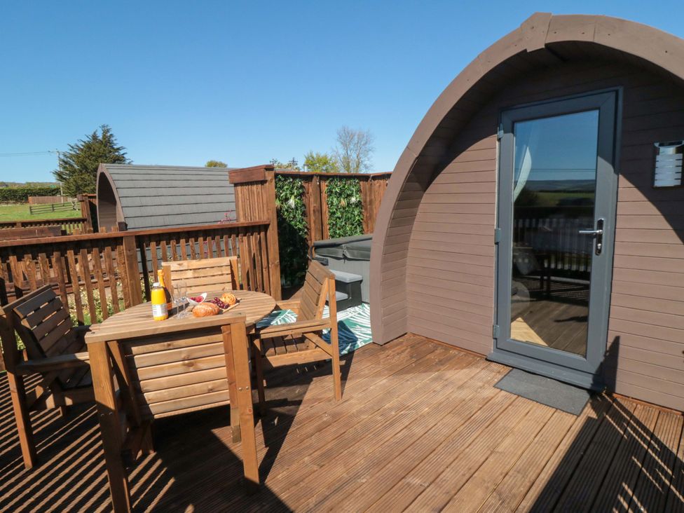 A deck with a table and chairs at Fern Folly in Whitby
