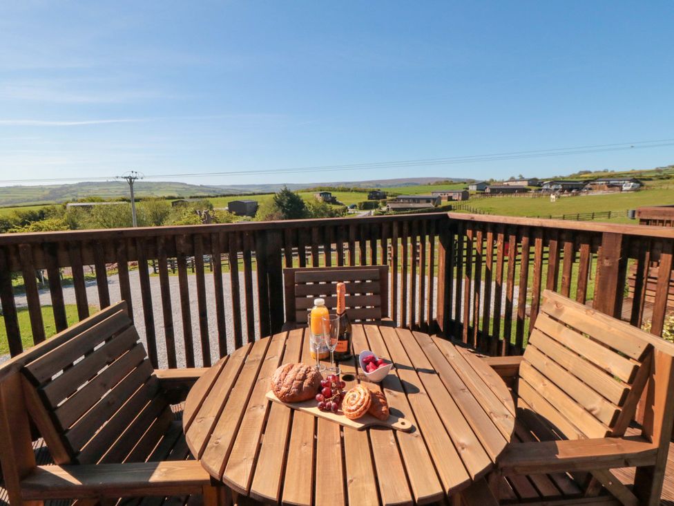 A table with pastries and drinks on a deck at Fern Folly in Whitby