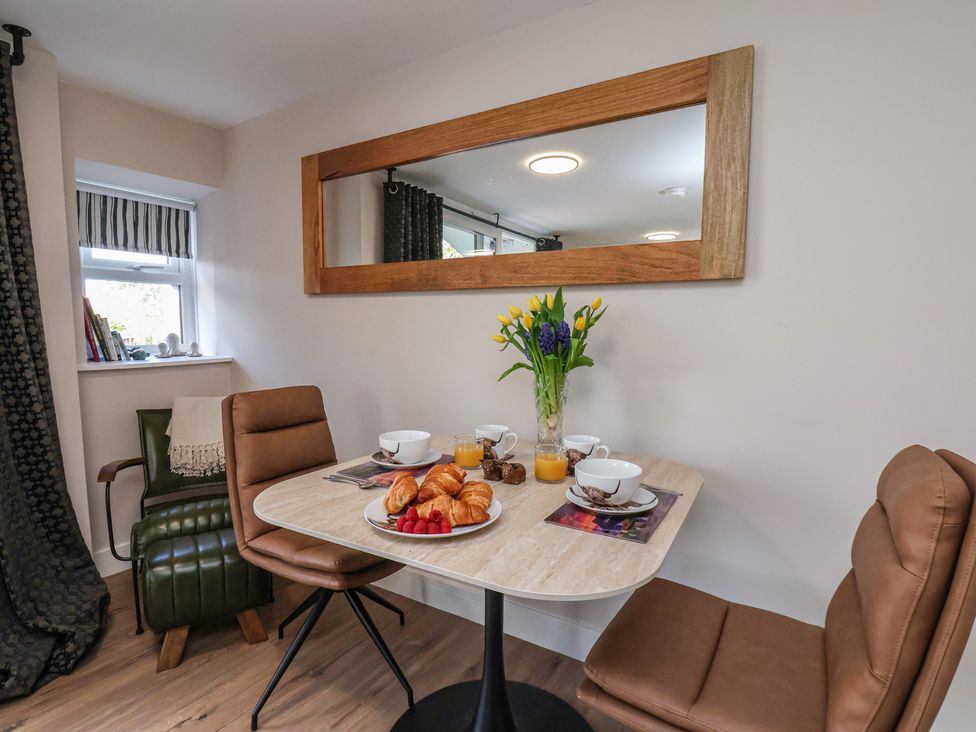 A dining room with a table set for breakfast at Little Holm Garth 