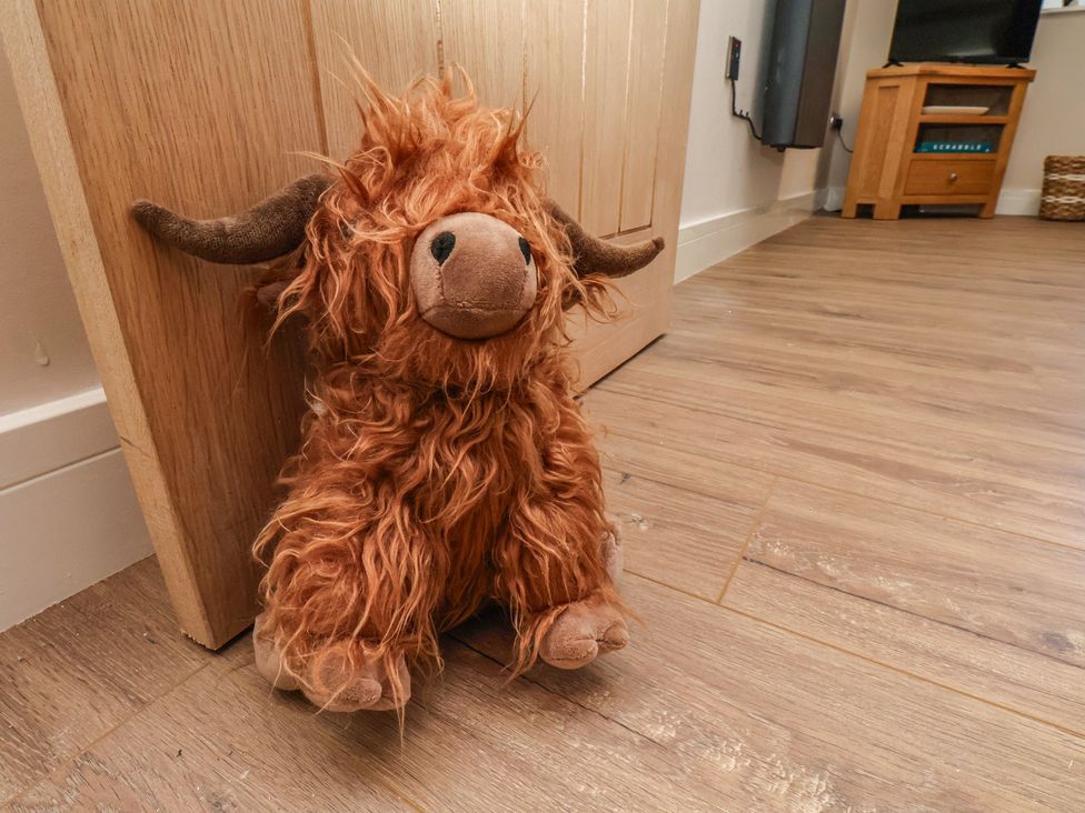 A plush toy in front of a door at Little Holm Garth in 