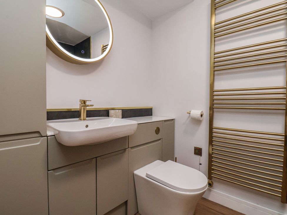 A bathroom with a sink and toilet at Little Holm Garth