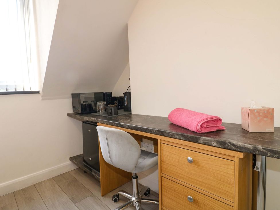 An office with a desk and coffee maker at 57 Abbey Street