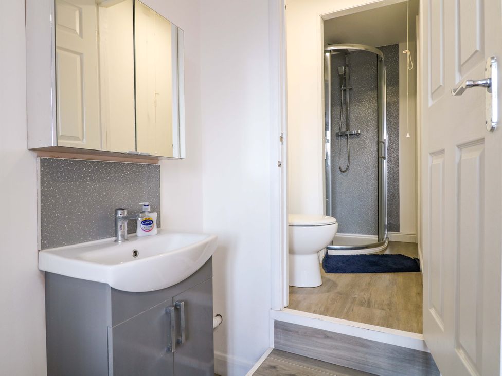 A bathroom with a sink and shower at 57 Abbey Street