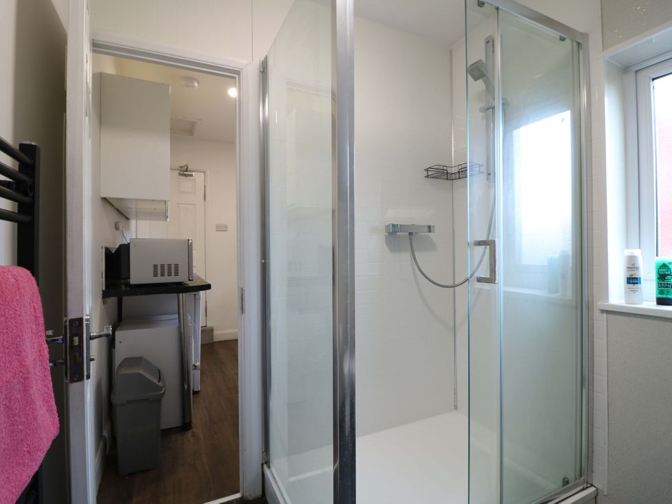 A bathroom with a shower and sink at 57 Abbey Street
