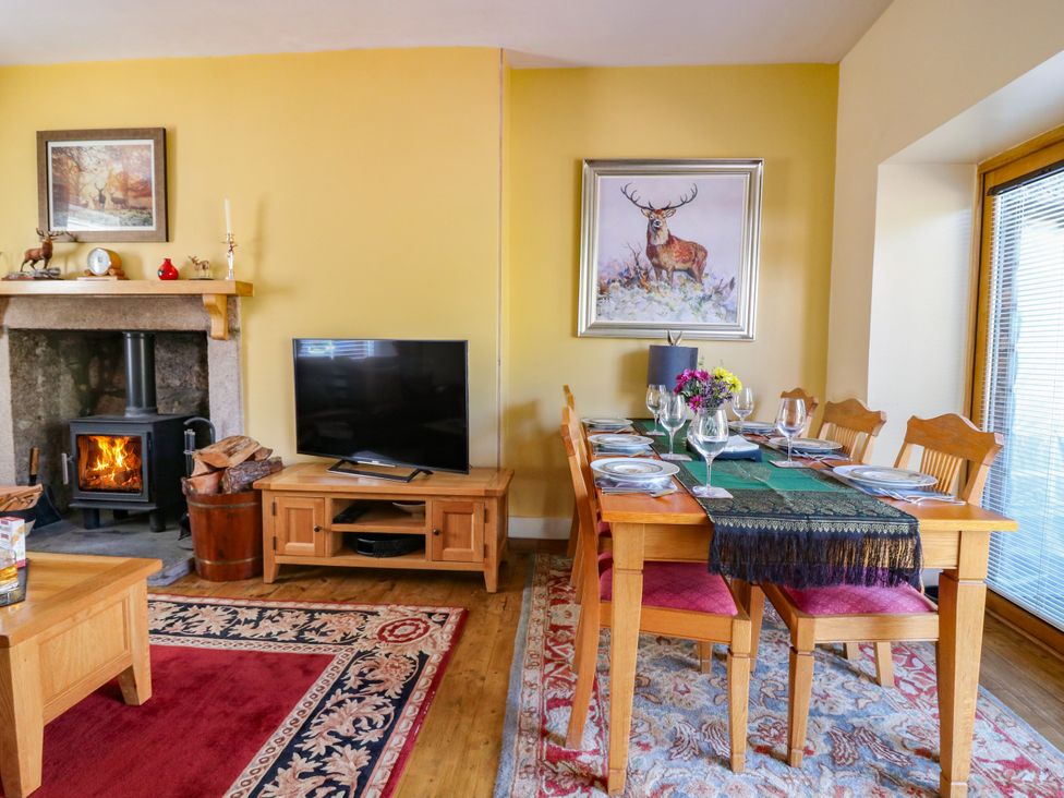 A dining room with a table set for dinner at St Kilda in Ballater