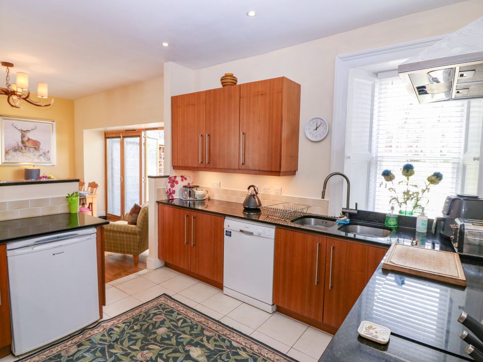 A kitchen with cabinets and appliances at St Kilda in Ballater