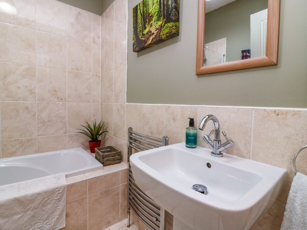 A bathroom with a sink and bath tub at St Kilda in Ballater