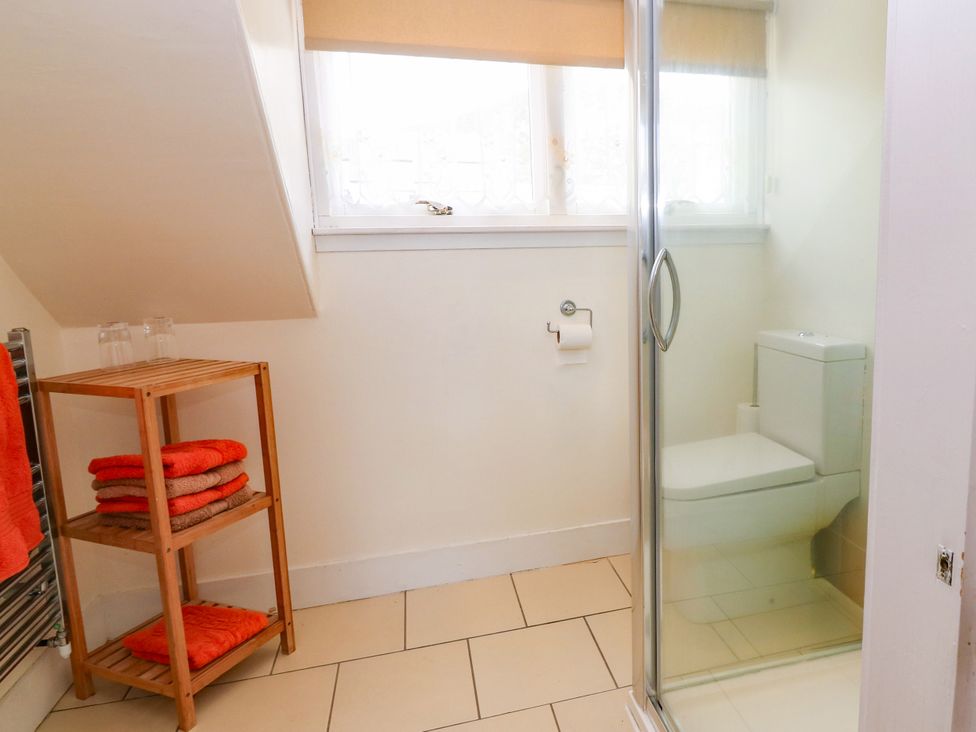 A bathroom with a shower and toilet at St Kilda in Ballater
