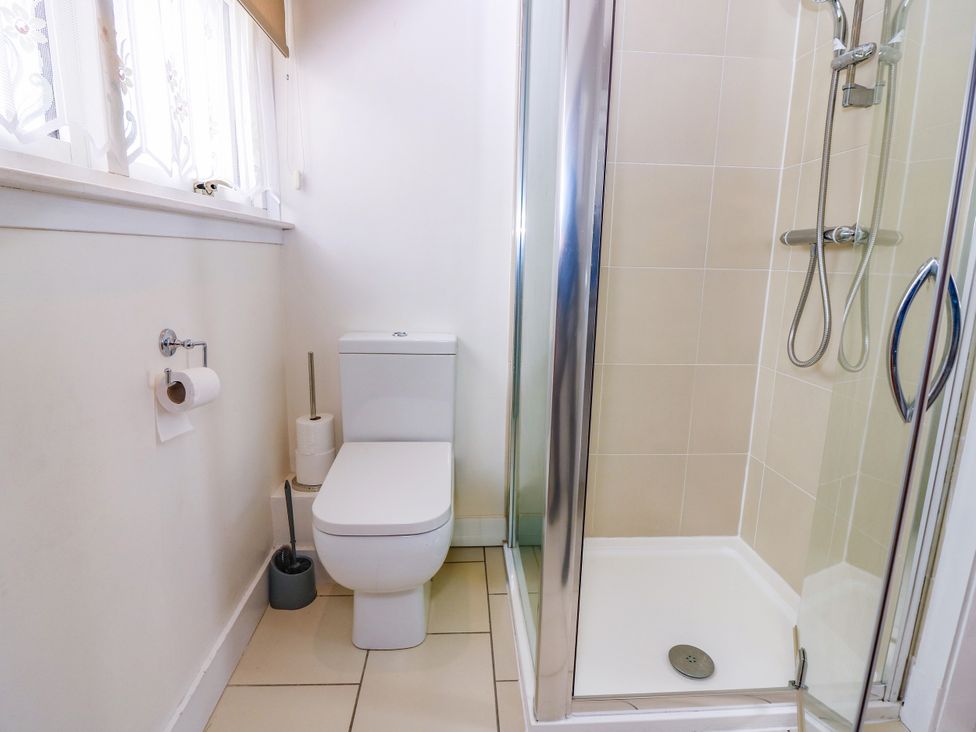 A bathroom with a toilet and shower at St Kilda in Ballater