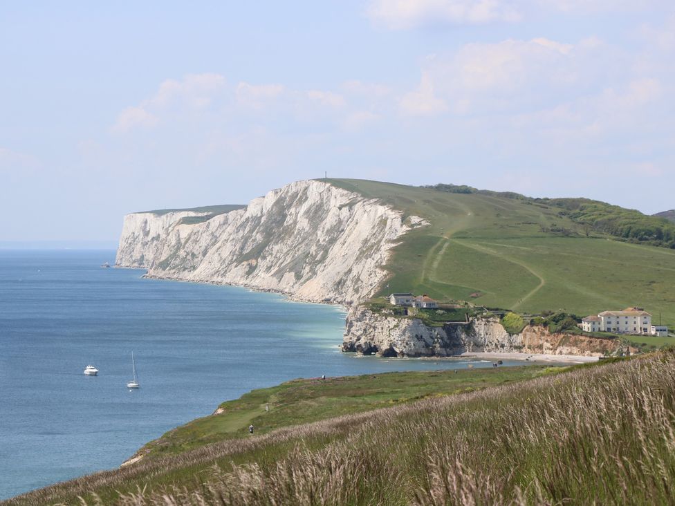 A coastal landscape featuring cliffs and ocean at 8 Manor Villas Totland Bay