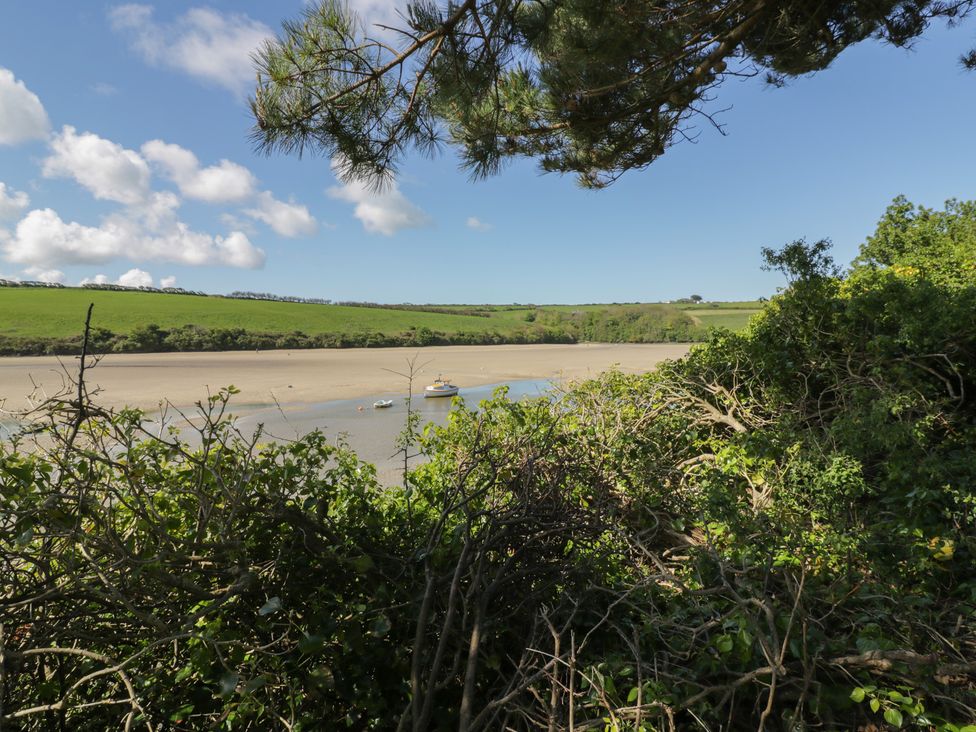A river with boats and green hills at Shamrocks Cove Caravan 