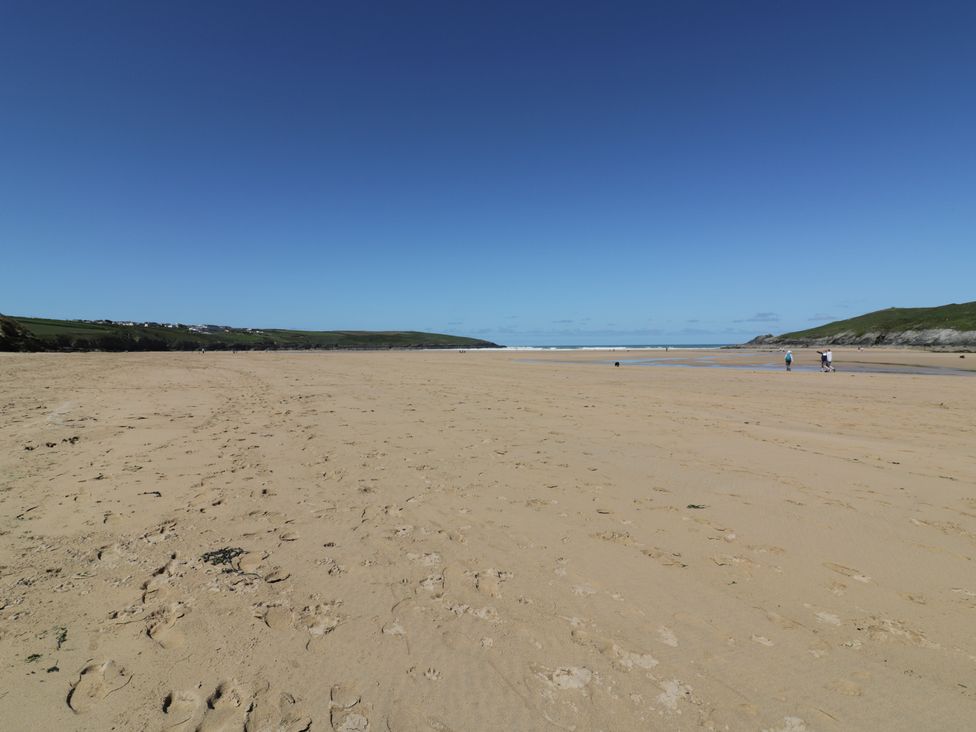 A beach with sand and water at Shamrocks Cove Caravan