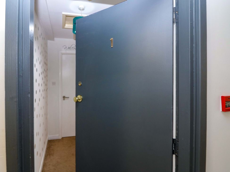 An entrance with a front door and wall features at Apartment 1 in Dyce
