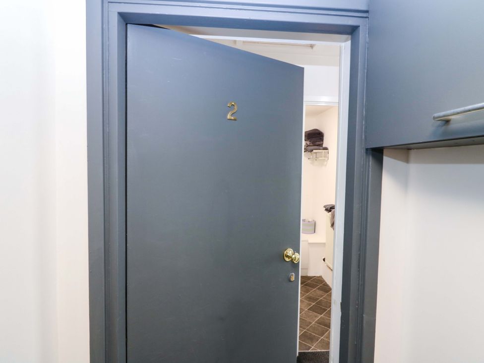 A bathroom door with number 2 and towels visible at Apartment 2 Dyce
