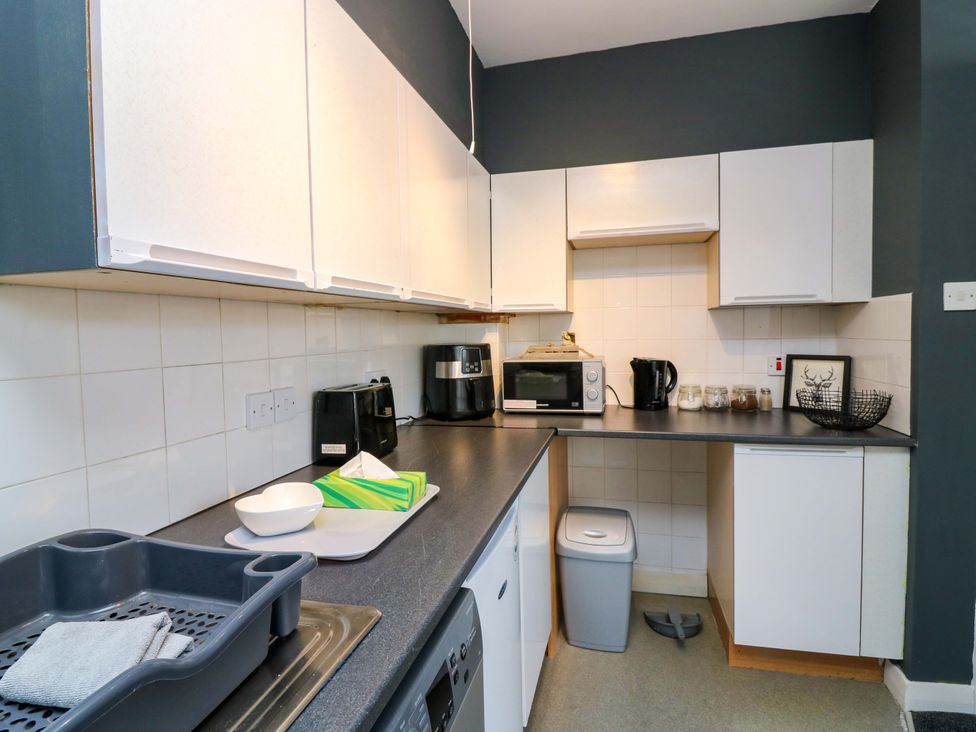 A kitchen with appliances and utensils at Apartment 2 in Dyce