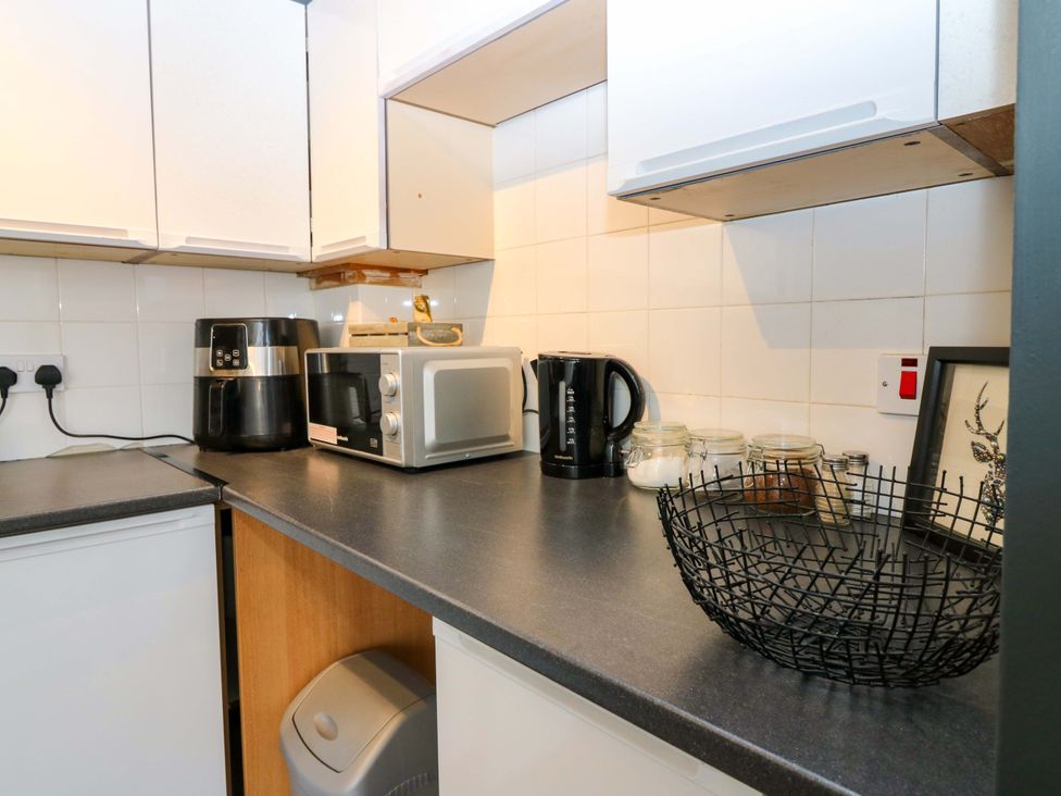 A kitchen with various appliances on the countertop at Apartment 2 Dyce