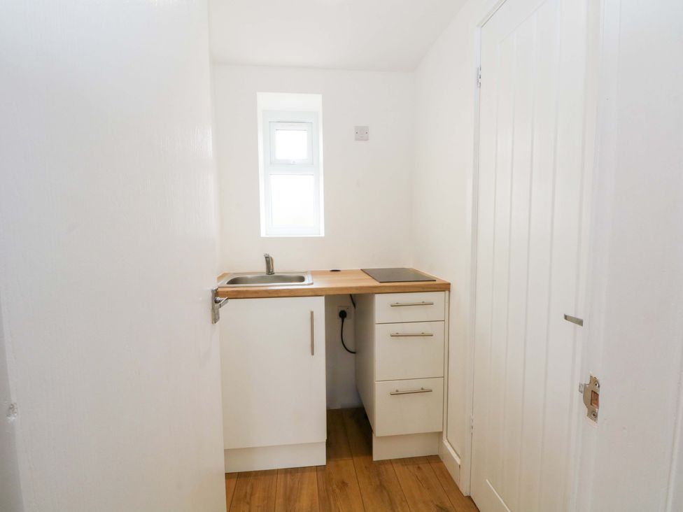 A kitchen with a sink and worktop at 1 bed no. 4 in Chorley