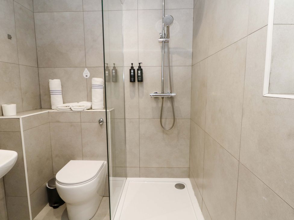 A bathroom with a shower and toilet at 2 bed no. 2 Chorley