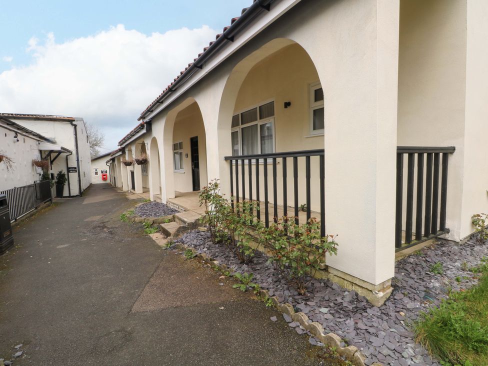 An outdoor area with a pathway and porch at 2 bed no. 5 in Chorley