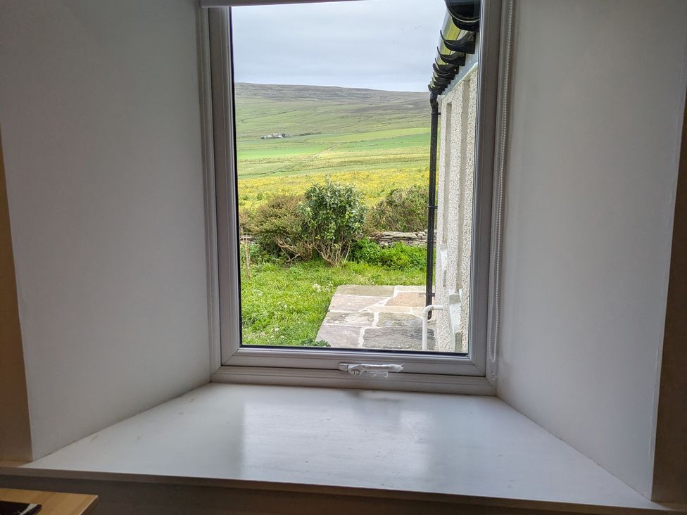 A window view with grassy landscape at Lower Hammerfield Rousay, Orkney Islands