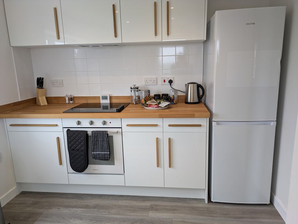 A kitchen with appliances and utensils at Lower Cottage in Rousay, Orkney Islands
