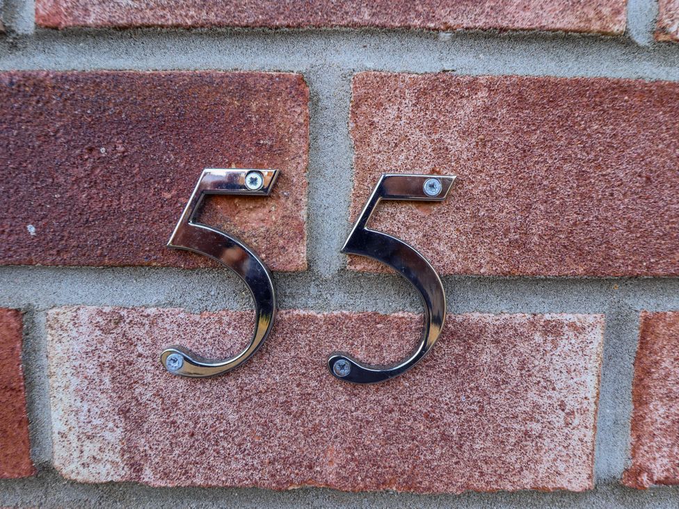 Number 55 on a brick wall at 55 Broadway in Lincoln