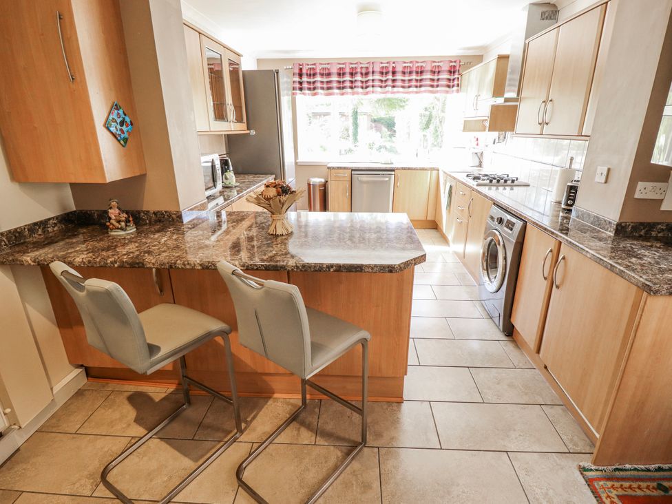 A kitchen with a countertop and appliances at 55 Broadway in Lincoln