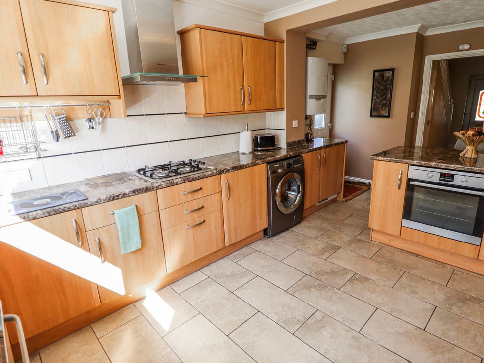 A kitchen with cabinets and appliances at 55 Broadway in Lincoln