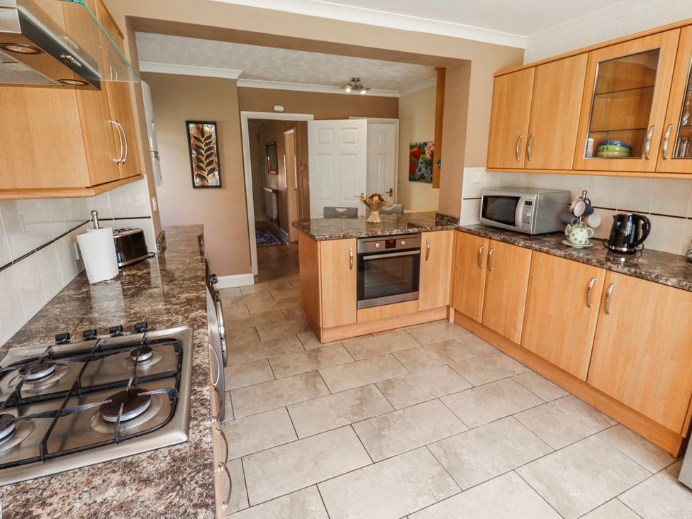 A kitchen with cabinets and appliances at 55 Broadway in Lincoln