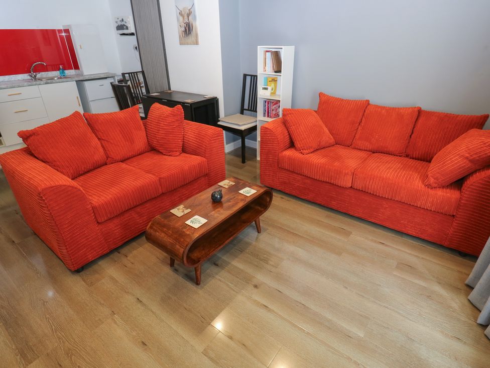 A living room with two sofas and a coffee table at No.1 Spa Mill Lodge in Huddersfield