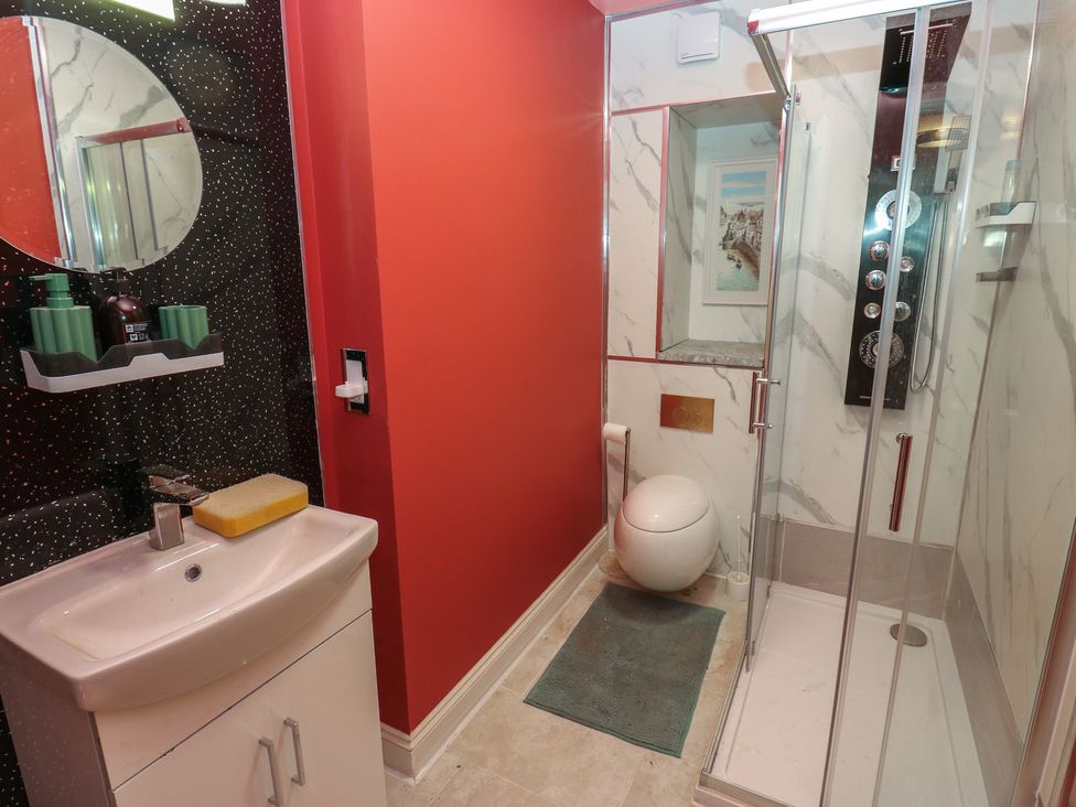 A bathroom with a shower and sink at No.1 Spa Mill Lodge in Huddersfield